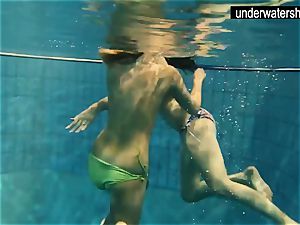 two sumptuous amateurs showing their bods off under water